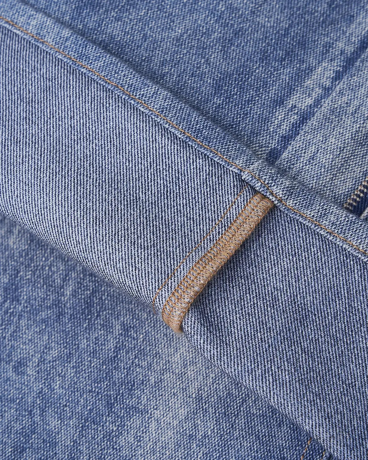 Digital printing denim jeans by INFLATION with bold, colorful graphic patterns on classic blue denim fabric.