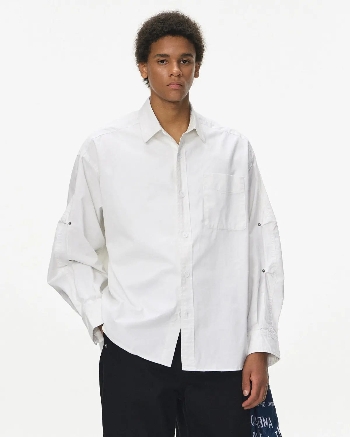 Acid wash cargo shirt jacket by INFLATION, streetwear style with multiple pockets and a relaxed fit, displayed on a hanger.