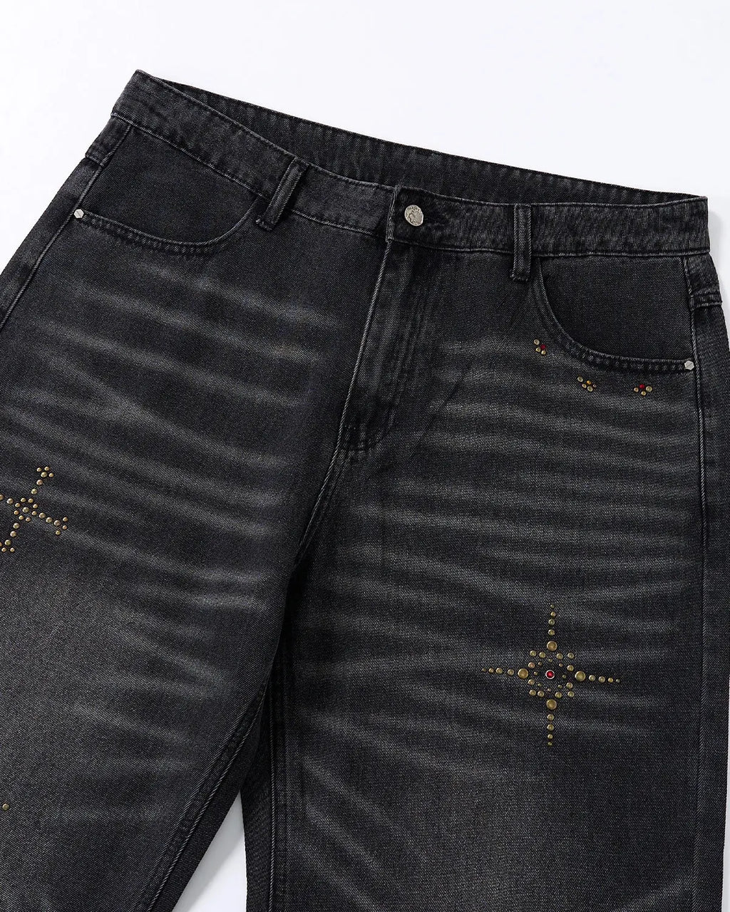 Distressed rhinestone ripped baggy jeans by INFLATION, featuring frayed edges, rips, and sparkling rhinestone details.