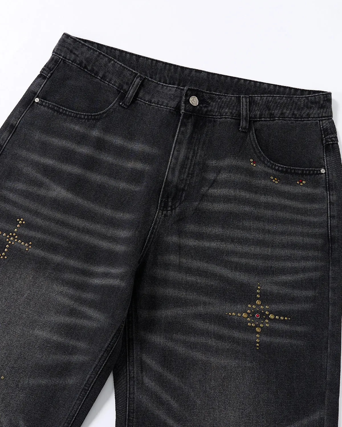 Distressed rhinestone ripped baggy jeans by INFLATION, featuring frayed edges, rips, and sparkling rhinestone details.