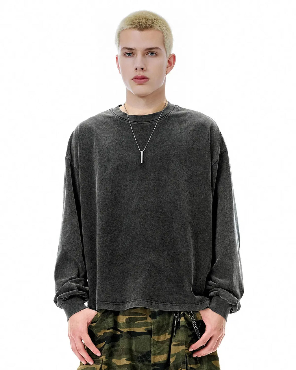 Distressed washed long sleeve tee by INFLATION, featuring a relaxed fit and vintage-inspired, faded fabric with a worn look.