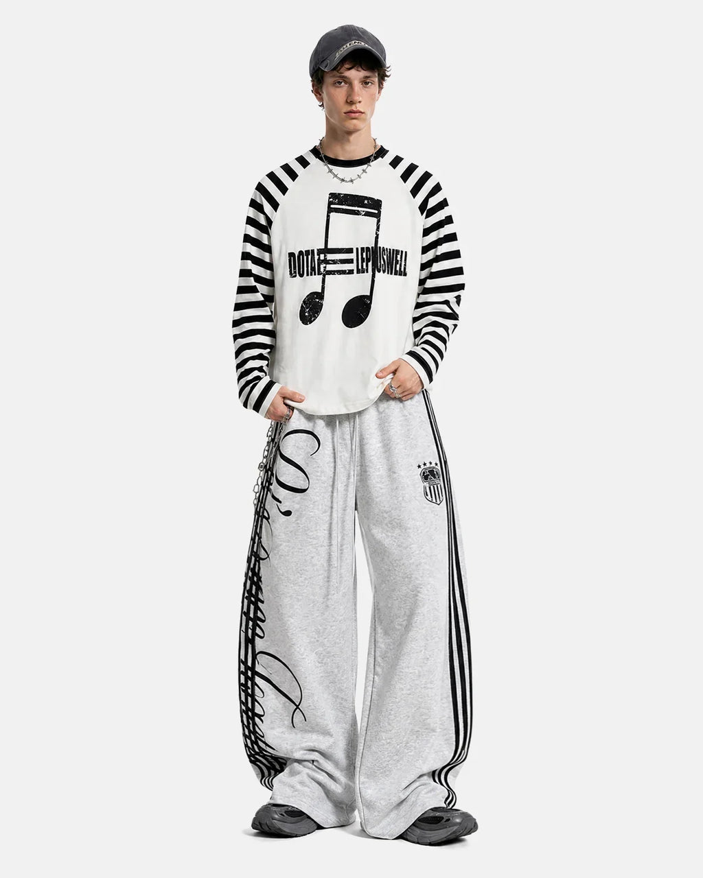 Inflation streetwear long sleeve T-shirt with bold music graphic and striped pattern, casual streetwear style for men and women.