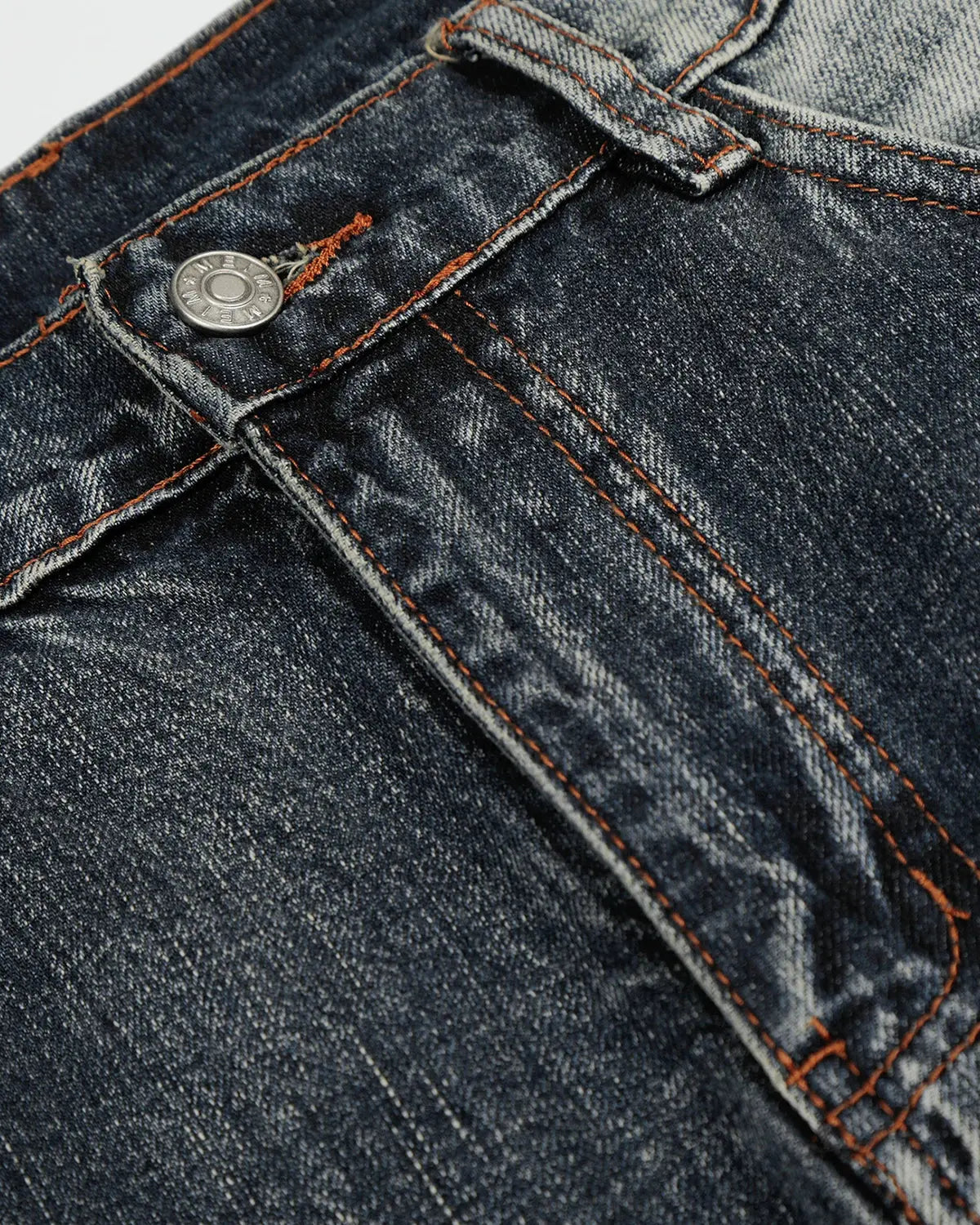 Faded Whisker Baggy Jeans by INFLATION showing relaxed fit, distressed denim, and faded detailing on a casual streetwear style.