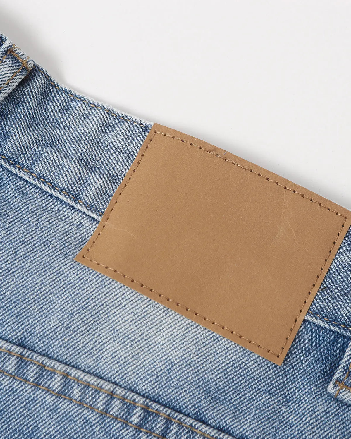 Ripped mid-length washed denim shorts by INFLATION, stylish streetwear pants with distressed details and casual fit.