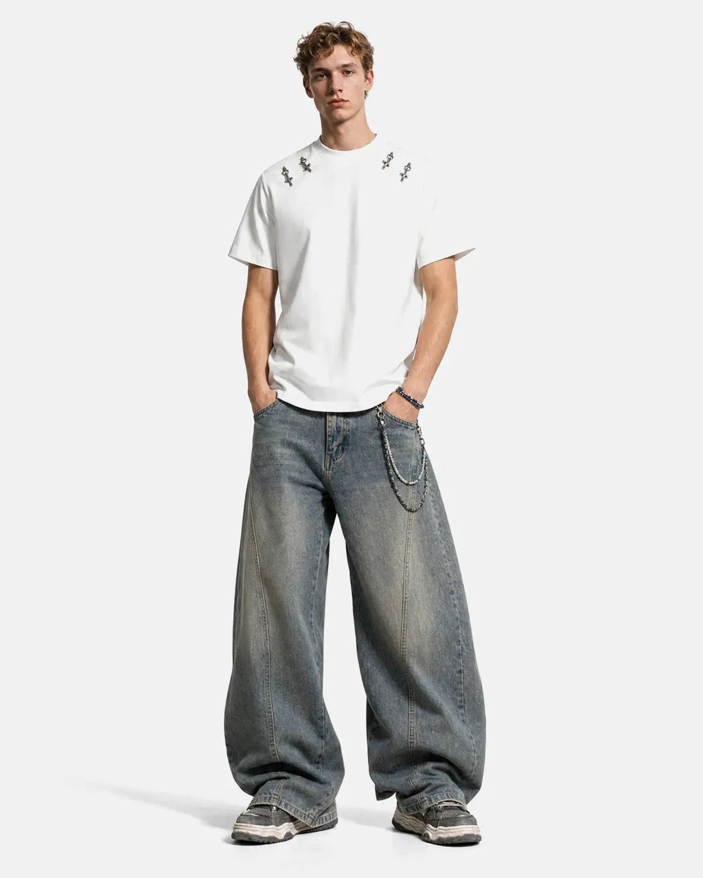Inflation Streetwear cotton T-shirt featuring metal buckle detail, casual fit with graphic print, worn by a model.