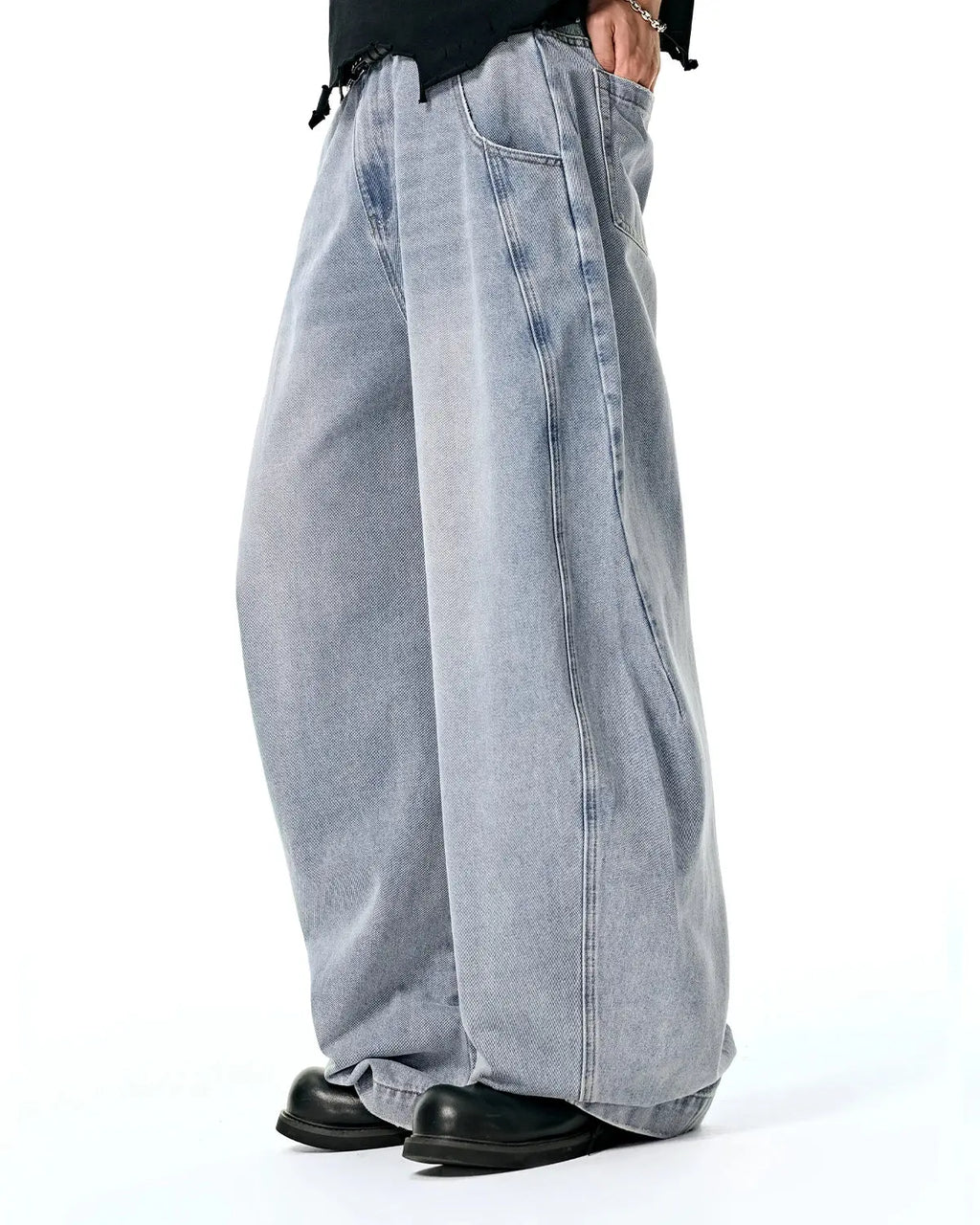 Acid washed distressed barrel jeans by INFLATION, casual pants with a relaxed fit and worn-in distressed details.