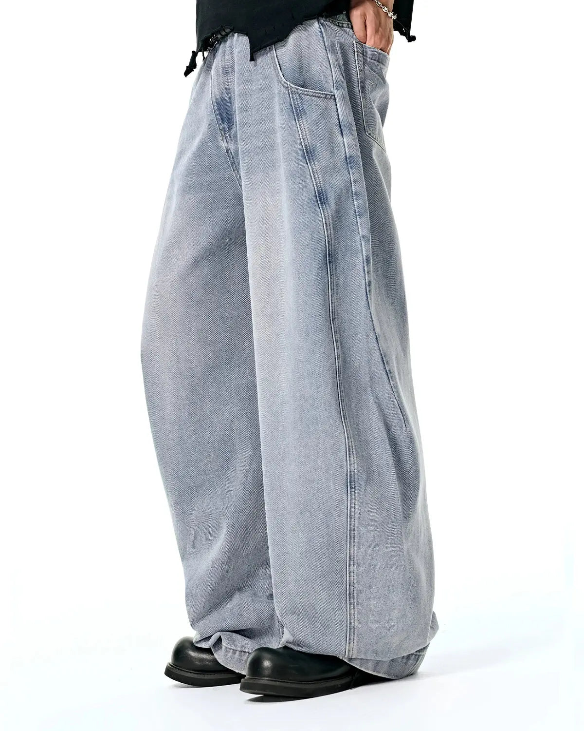 Acid washed distressed barrel jeans by INFLATION, casual pants with a relaxed fit and worn-in distressed details.