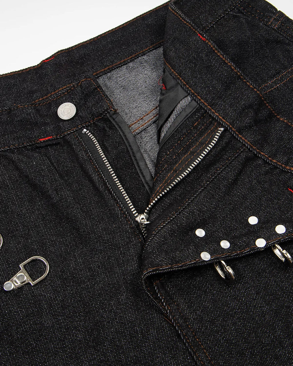 Raw baggy jeans with asymmetric buckle details from INFLATION, featuring a relaxed fit and streetwear style.
