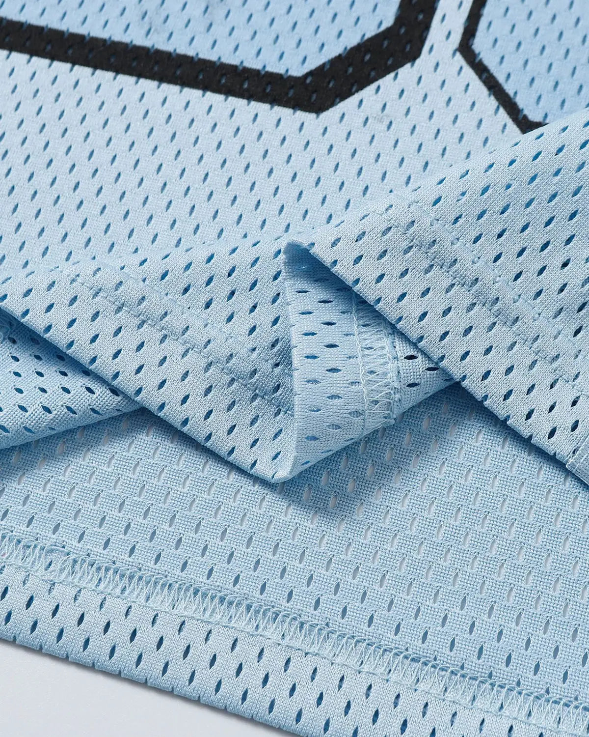 Inflation Mesh Patchwork Oversized Jersey featuring mixed fabric panels and a relaxed streetwear style.