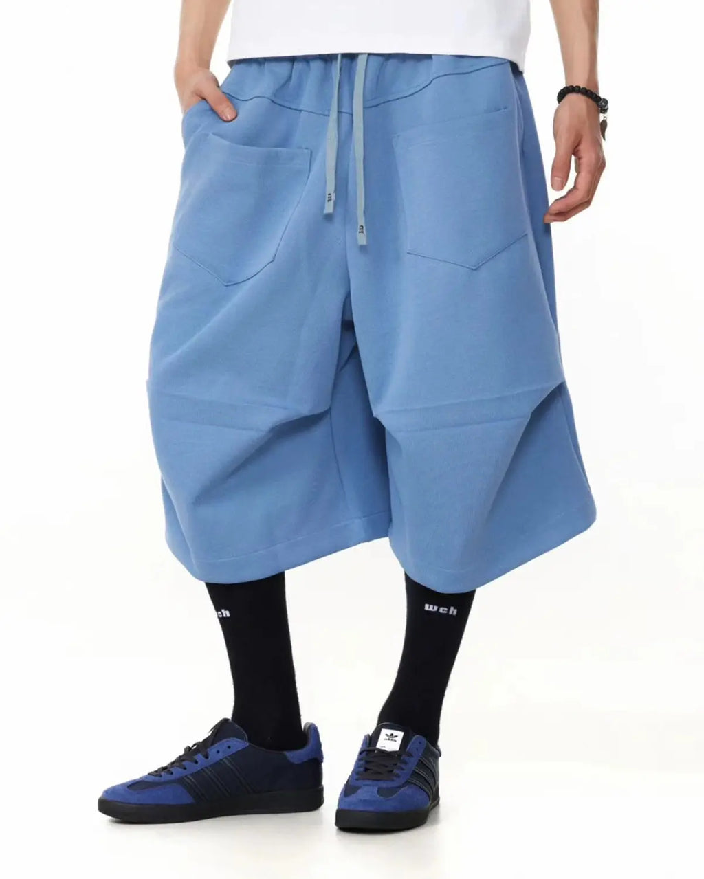 Baggy Sweat Shorts by INFLATION featuring a relaxed fit and casual streetwear style, shown in a comfortable fabric.