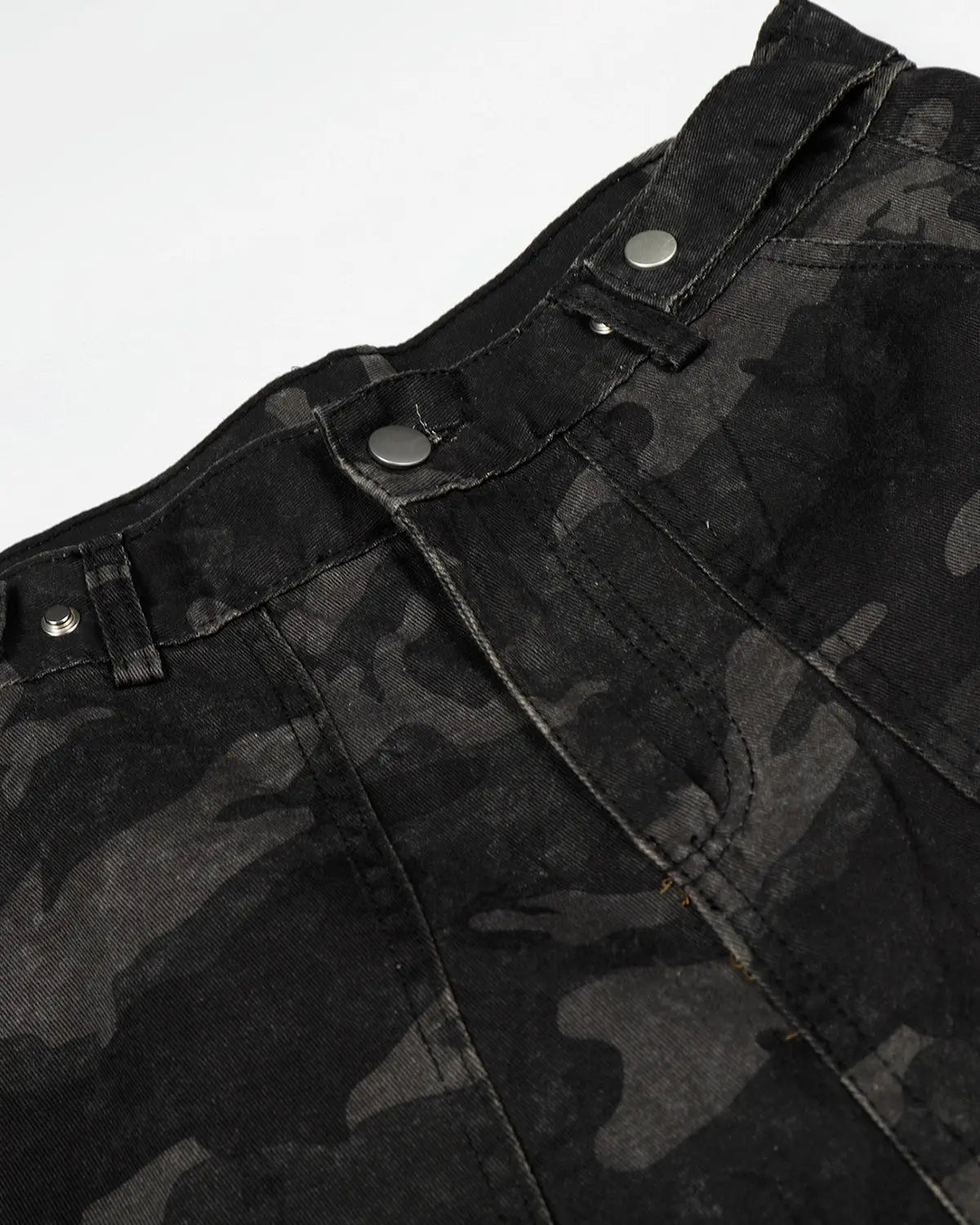 Dark camo cargo shorts by INFLATION, featuring multiple pockets and a relaxed fit, perfect for streetwear style.