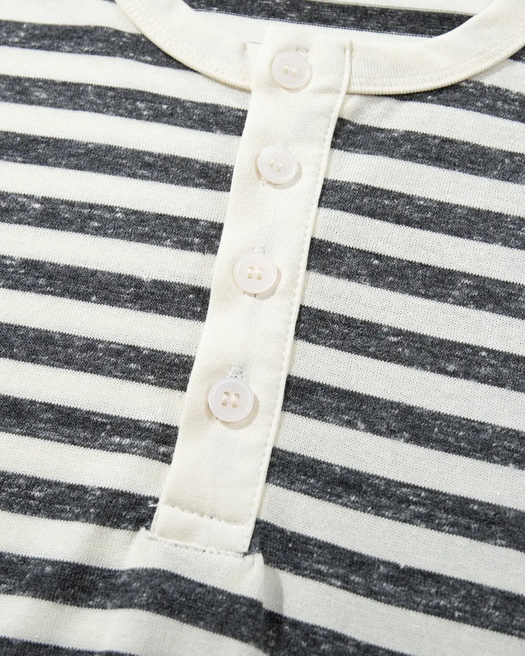 Inflation Streetwear striped Henley relaxed T-shirt in black and white, casual fit with buttoned neckline, front view.
