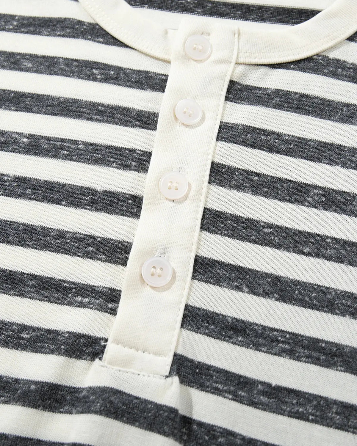Inflation Streetwear striped Henley relaxed T-shirt in black and white, casual fit with buttoned neckline, front view.