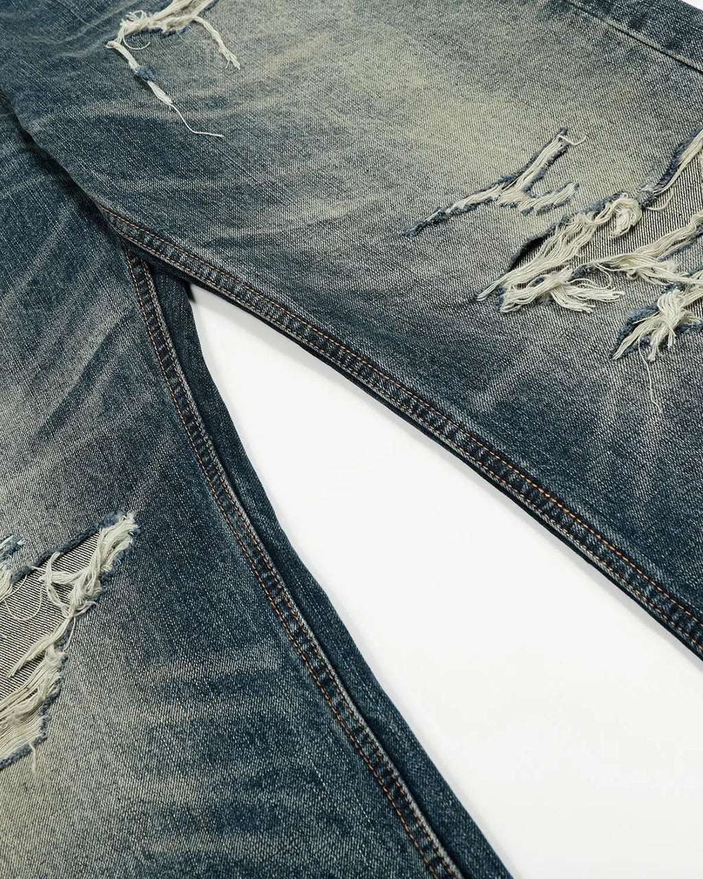 Vintage distressed baggy jeans by INFLATION featuring a relaxed fit and worn-in denim look.