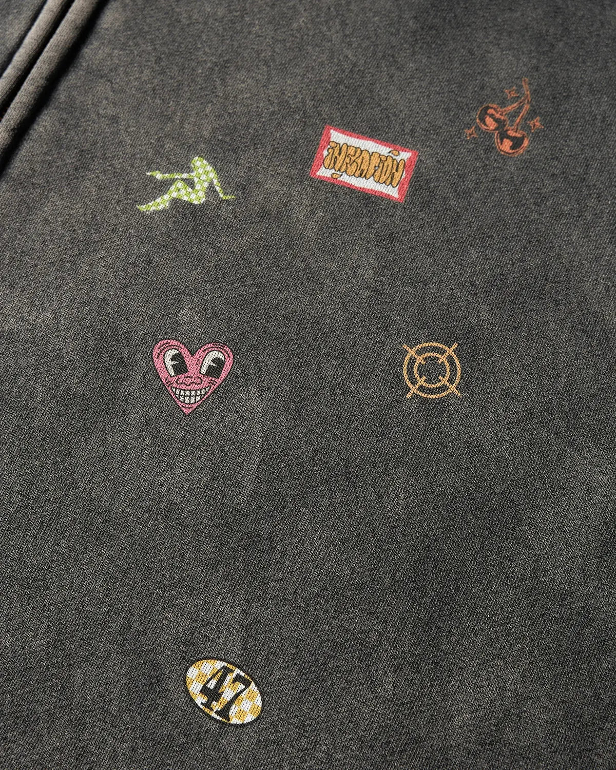 Distressed zip-up hoodie with funny stickers design from INFLATION streetwear, featuring bold graphics on a casual hoodie.