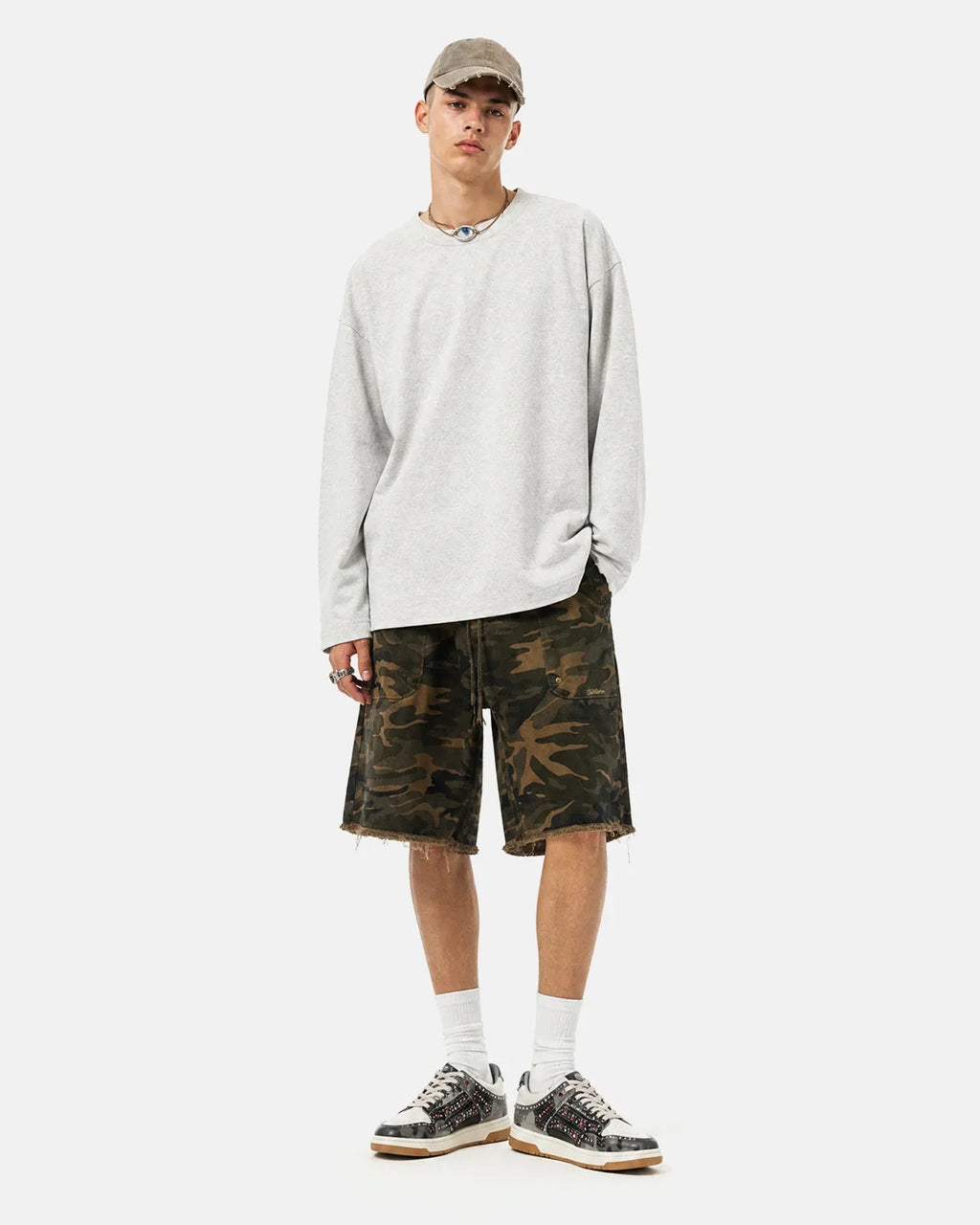 Inflation Streetwear frayed hem camo knee-length shorts with distressed details, casual streetwear style, shown on a neutral background.