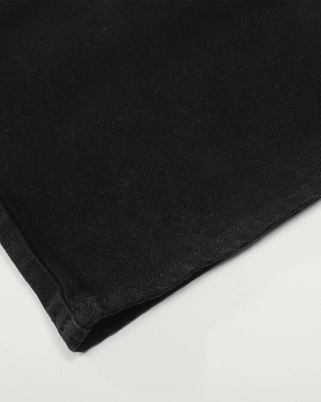 Black baggy jeans from Inflation Streetwear featuring loose fit and casual style, shown hanging on a hanger.