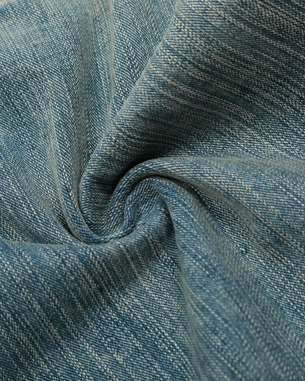 Deconstructed bamboo weave baggy jeans by INFLATION with relaxed fit, featuring distressed details and unique textile textures.