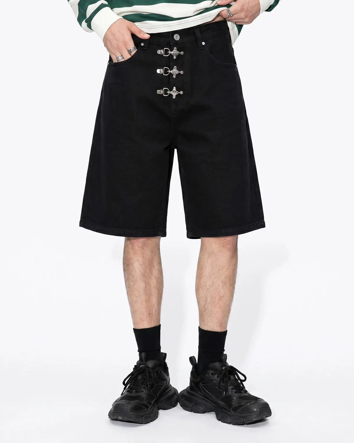 Metal clasp baggy jorts by INFLATION, featuring distressed denim, loose fit, and metal hardware, styled for streetwear fashion.