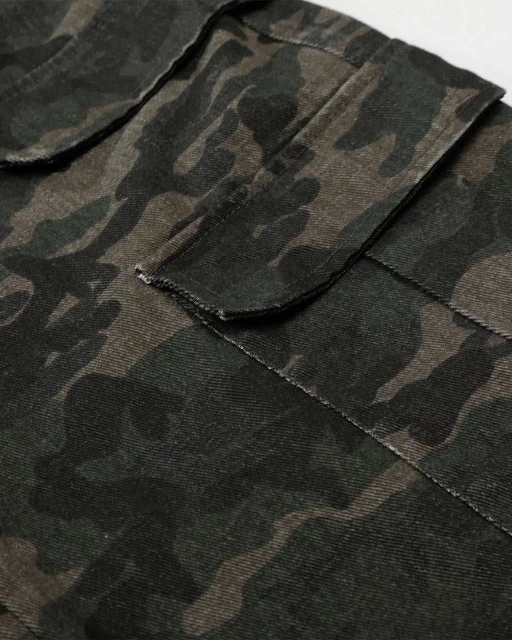 Inflation brand camo cargo pants with multiple pockets, casual streetwear style, featuring green and brown camouflage print.