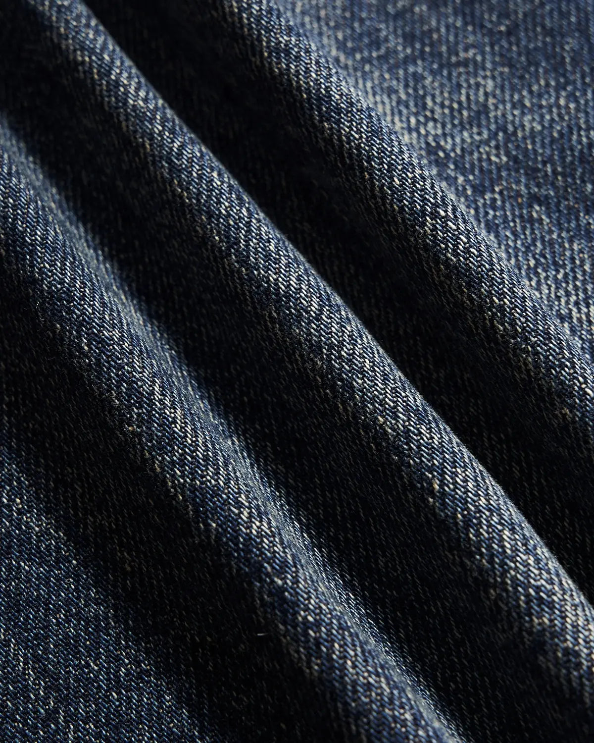INFLATION faded dirty baggy cargo jeans with distressed details and multiple pockets, laid flat for display.