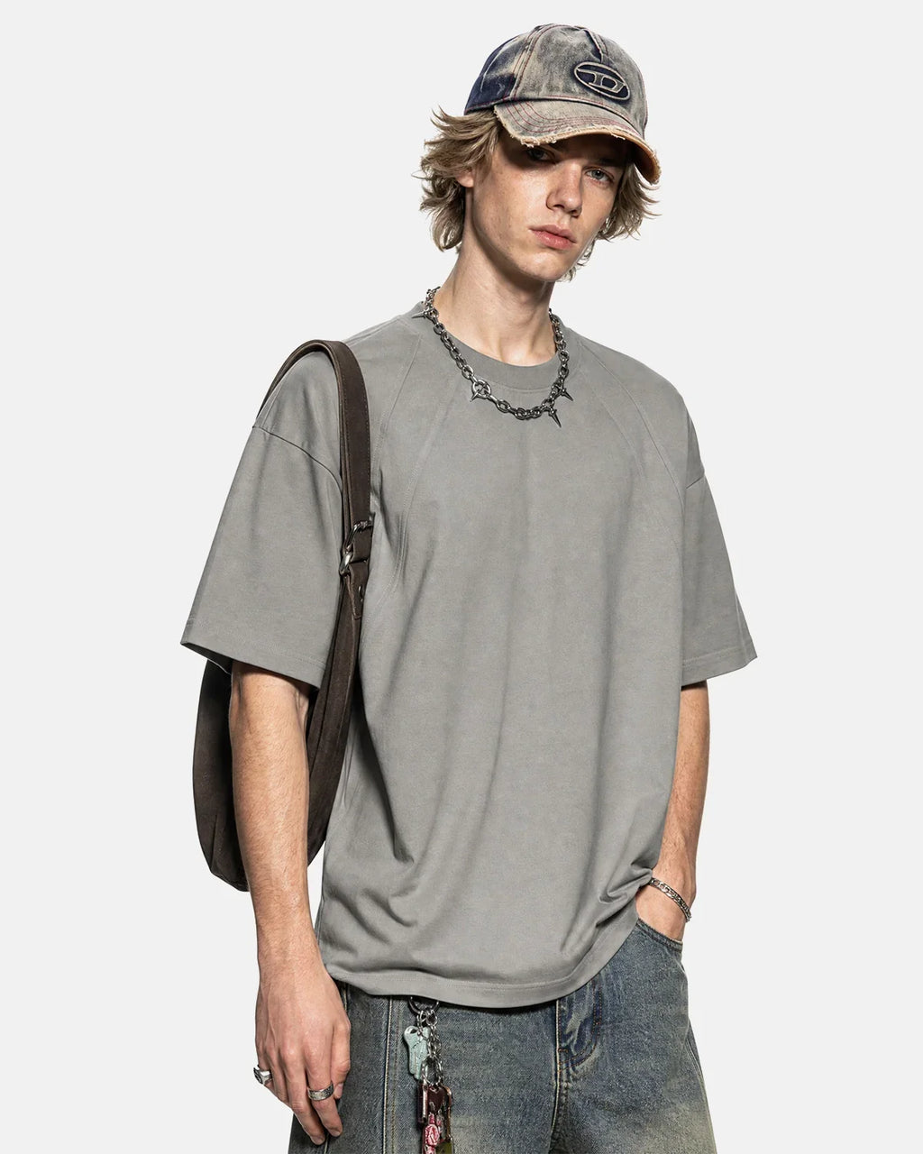 Boxy deconstructed T-shirt by INFLATION Streetwear featuring oversized fit and unique design details on a casual black tee.
