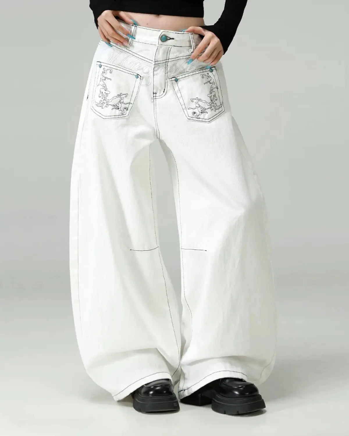 Graphic embroidered washed barrel jeans by INFLATION, stylish denim pants with embroidered design and washed finish.