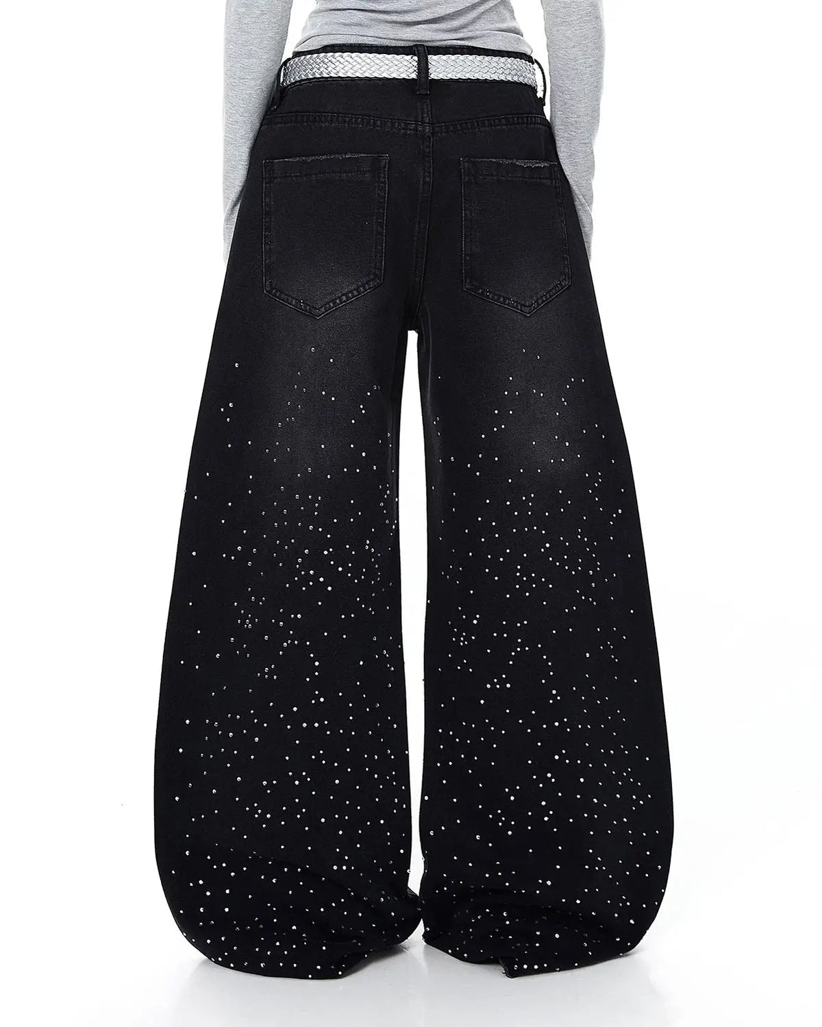 Acid wash rhinestone baggy jeans by INFLATION featuring distressed denim, rhinestone embellishments, and relaxed streetwear style.