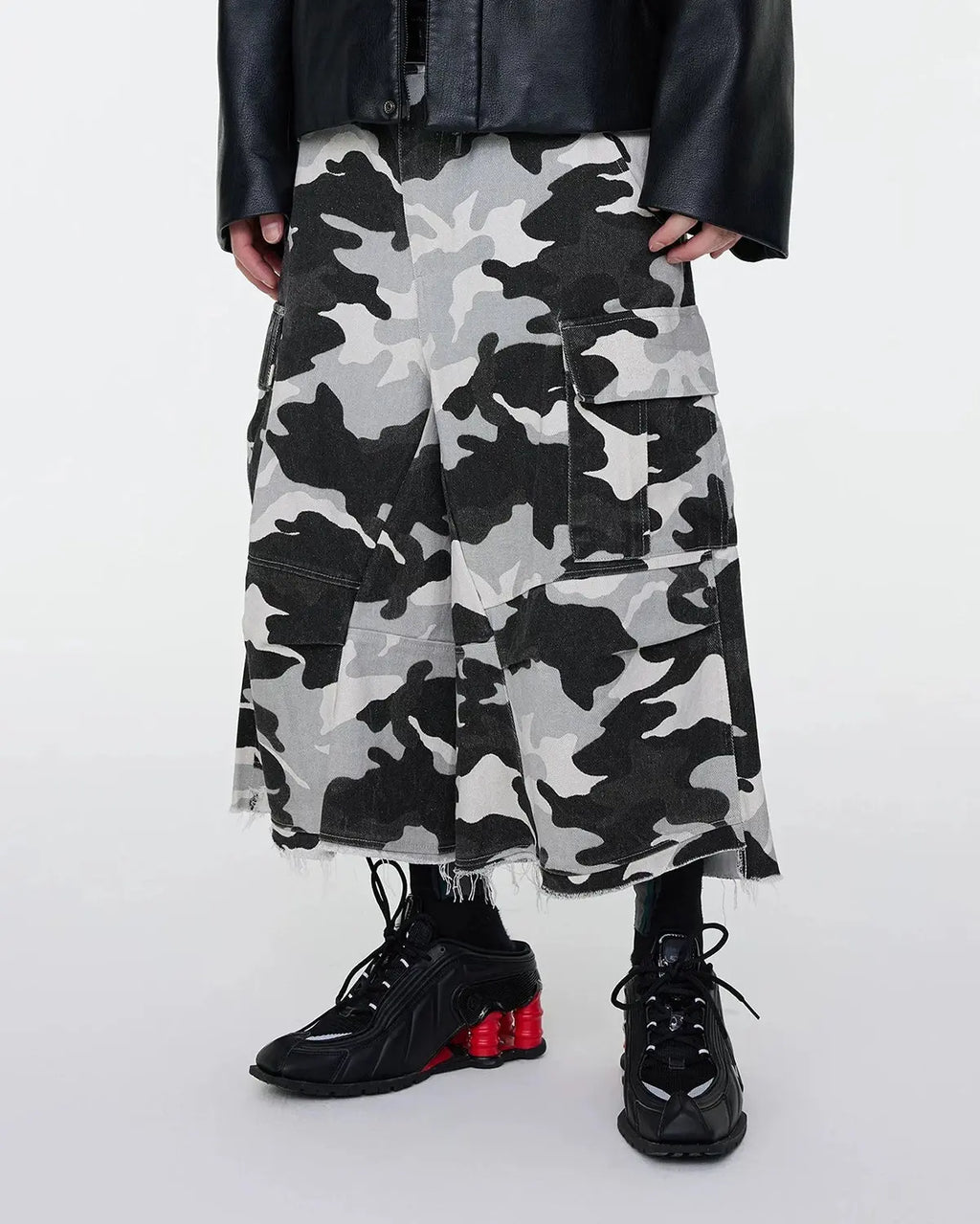 Inflation Glitter Camo Cargo Longline Shorts, stylish streetwear pants featuring glitter camo pattern and cargo pockets.