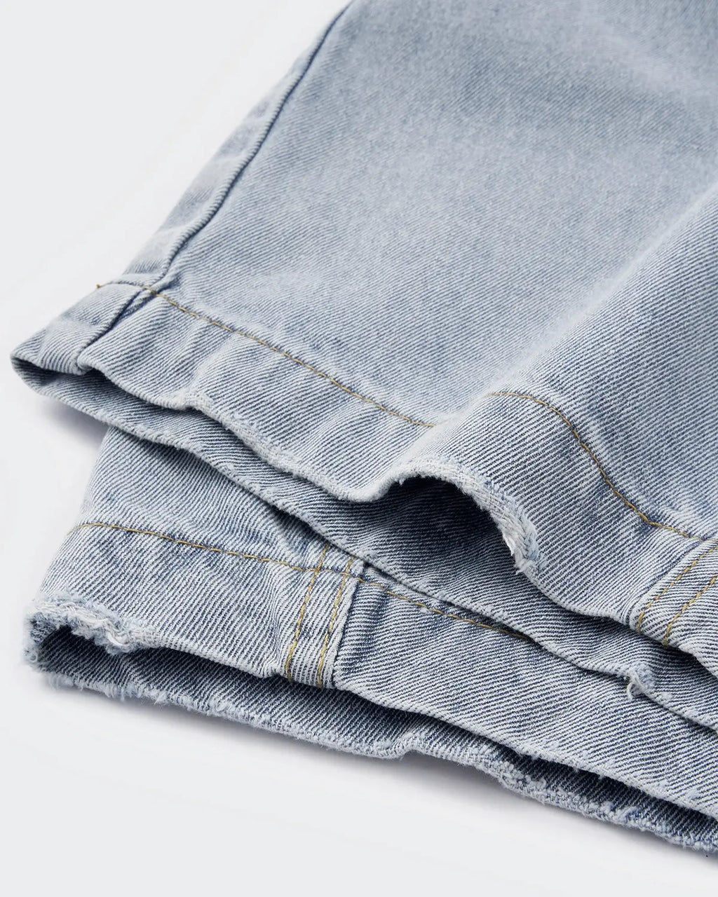 Acid washed distressed barrel jeans by INFLATION, casual pants with ripped details and a relaxed fit, displayed on a model.