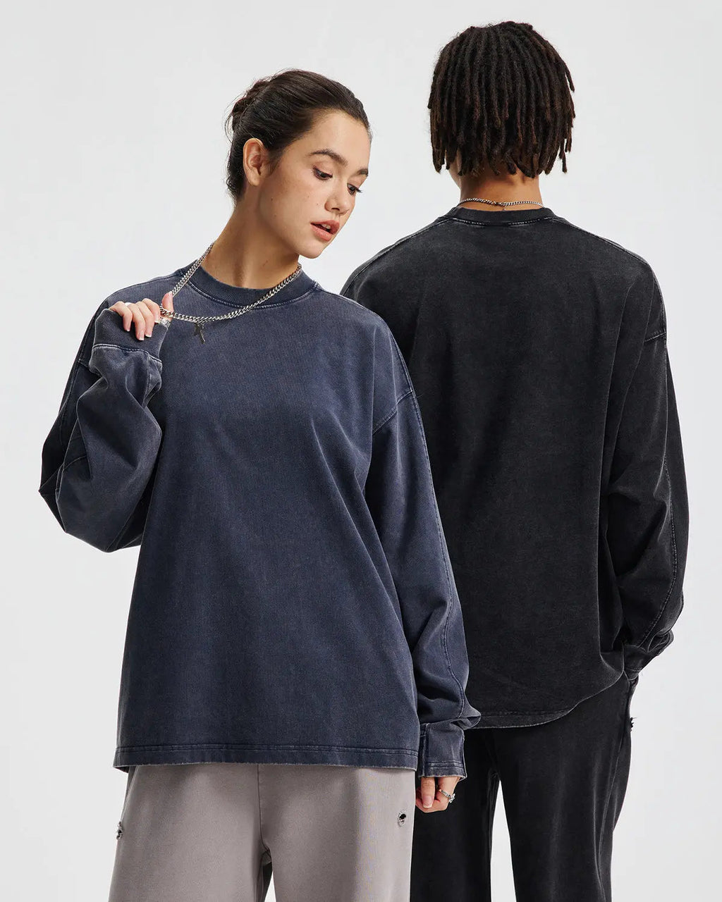 Inflation streetwear distressed acid wash oversized long sleeve T-shirt with a relaxed fit and vintage-inspired style.