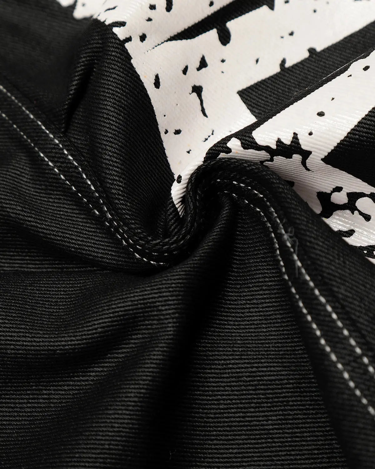 Letter graphic cargo barrel jeans by INFLATION featuring streetwear style, with bold letter graphics and relaxed fit.