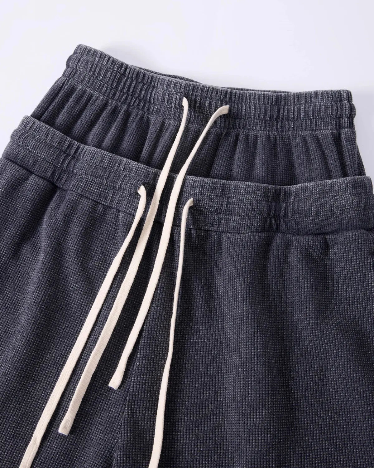 Inflation Streetwear double waist acid wash waffle shorts, men's casual pants with distressed, textured fabric and relaxed fit.