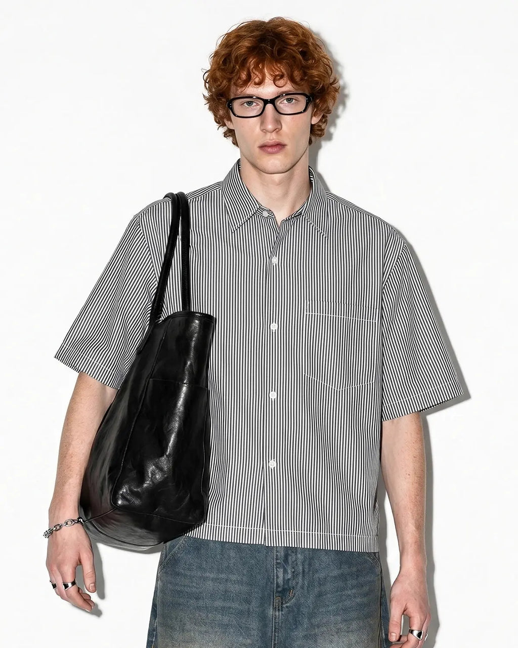 Boxy striped short-sleeve shirt by INFLATION featuring bold horizontal stripes and a relaxed fit, casual streetwear style.