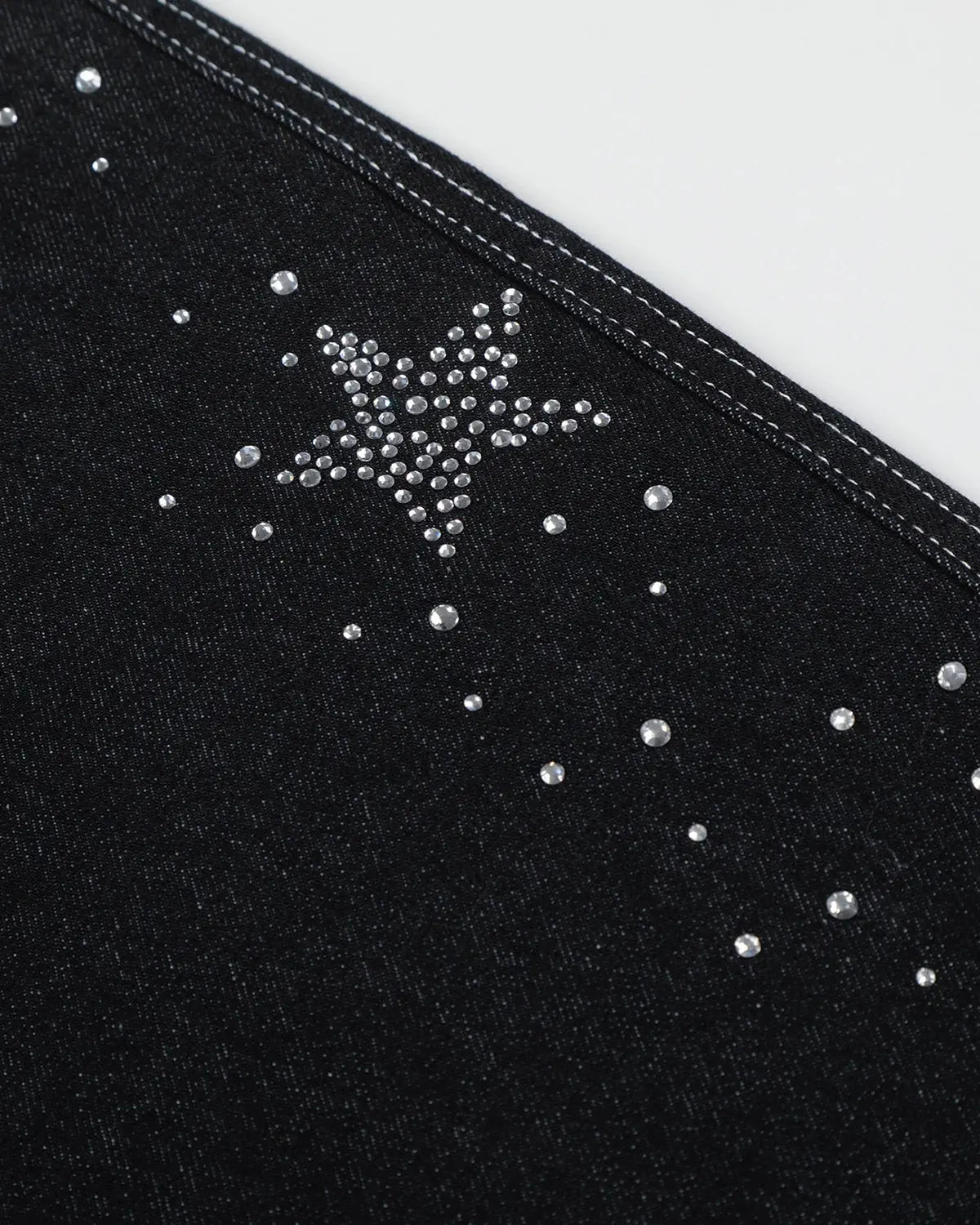 Star rhinestone denim shorts by INFLATION, stylish streetwear pants featuring sparkling star embellishments and classic blue denim fabric.
