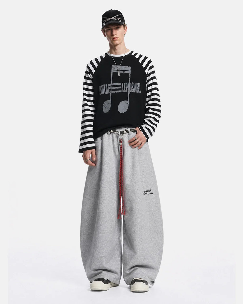 Inflation Music Graphic Striped Long Sleeve T-Shirt featuring bold musical notes and colorful stripes on a casual streetwear shirt.