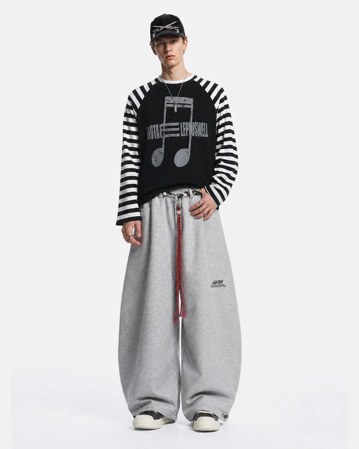 Inflation Music Graphic Striped Long Sleeve T-Shirt featuring bold musical notes and colorful stripes on a casual streetwear shirt.