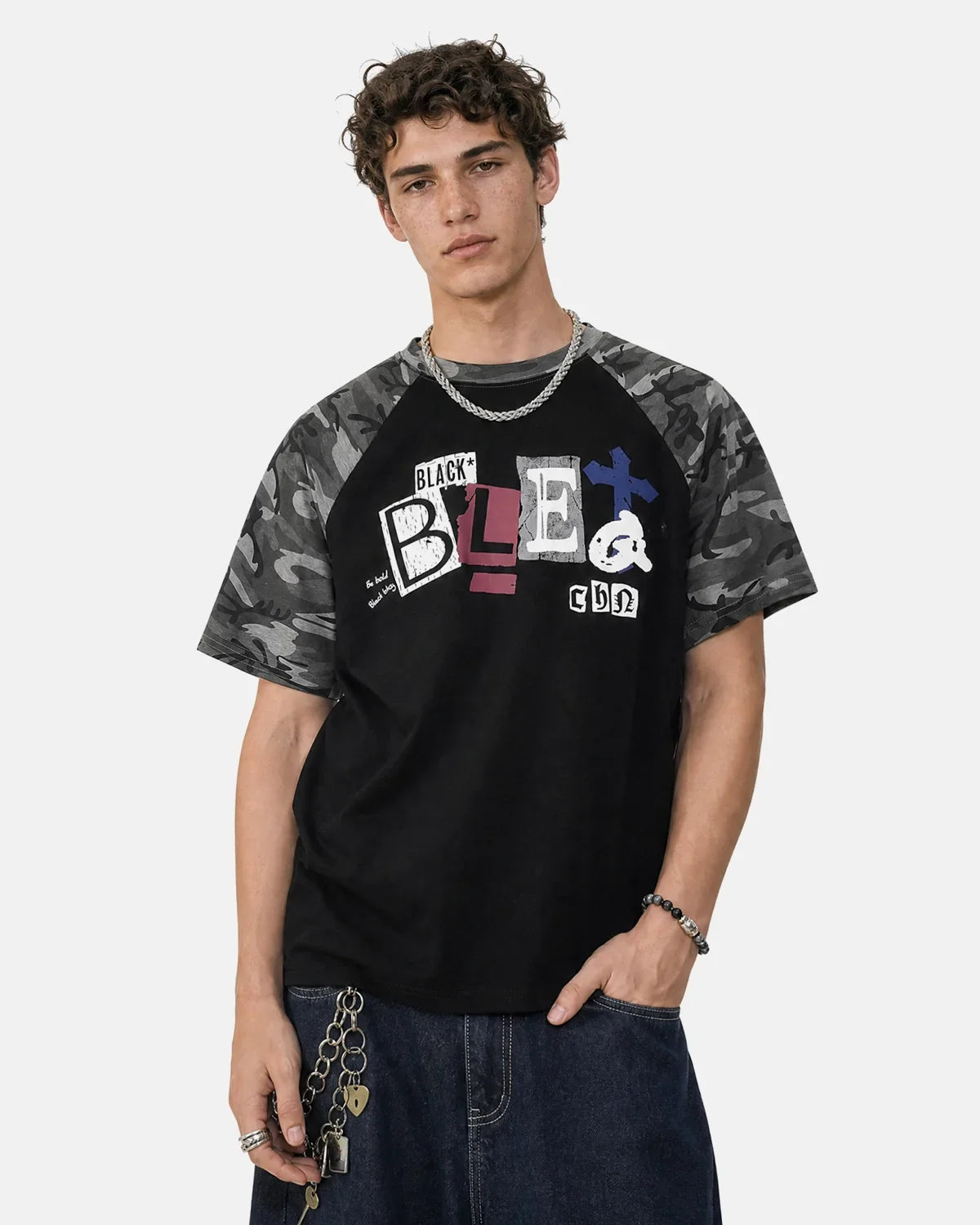 Camo Sleeve Graphic Boxy T-Shirt from INFLATION Streetwear featuring bold camo-patterned sleeves and a graphic design on the front.