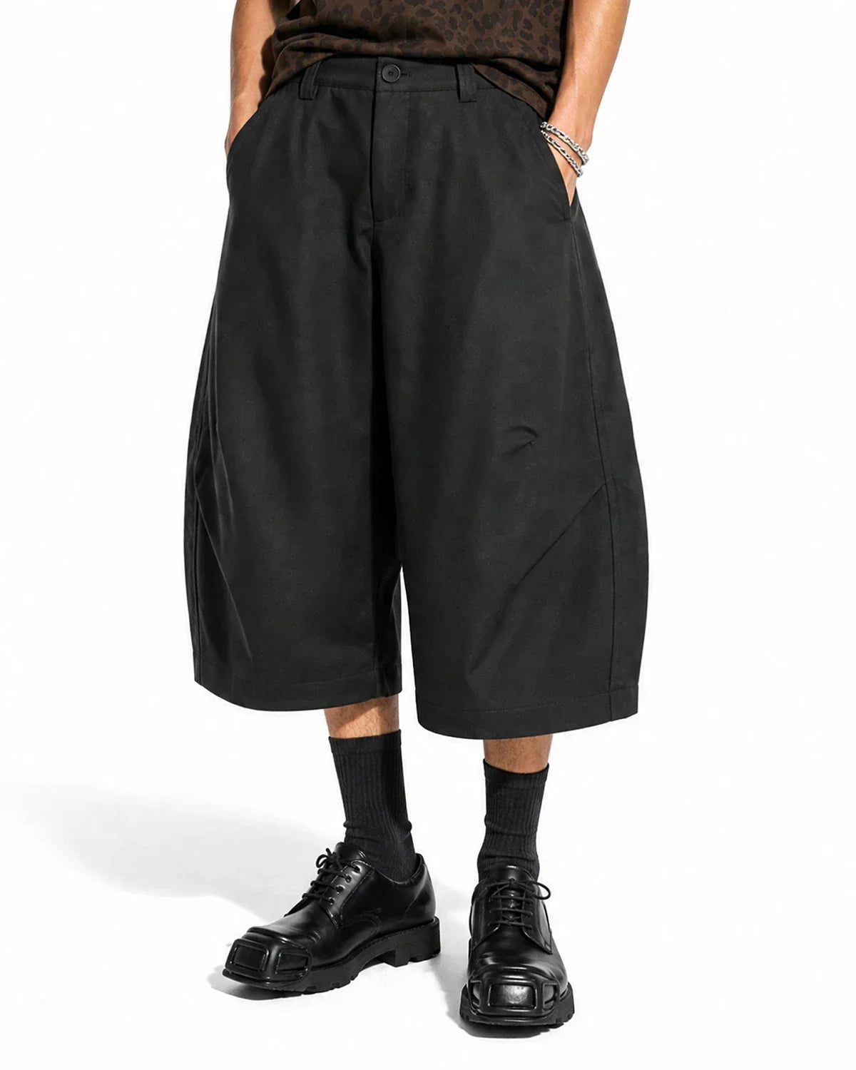 Inflation Streetwear pleated barrel tailored Bermuda shorts in khaki with a relaxed fit and cuffed hem, displayed on a mannequin.