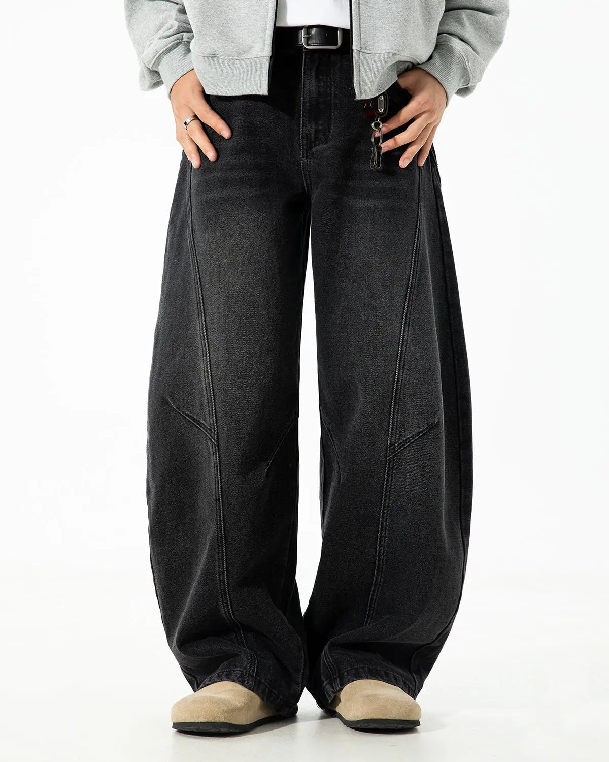 Curved seam deconstructed barrel jeans from Inflation Streetwear featuring faded denim and distressed details.