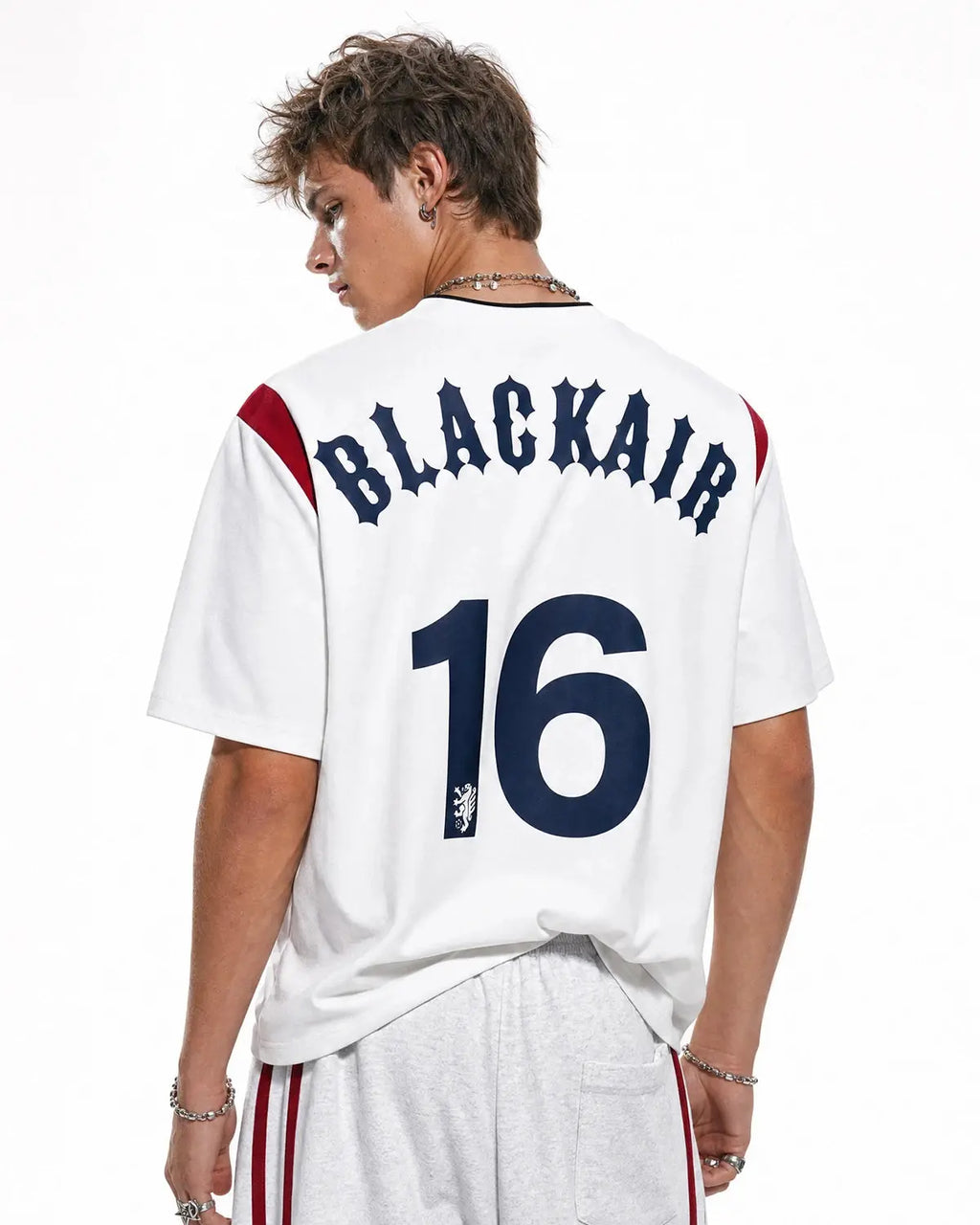 Retro color block embroidered jersey T-shirt by INFLATION featuring bold designs and vibrant streetwear style.