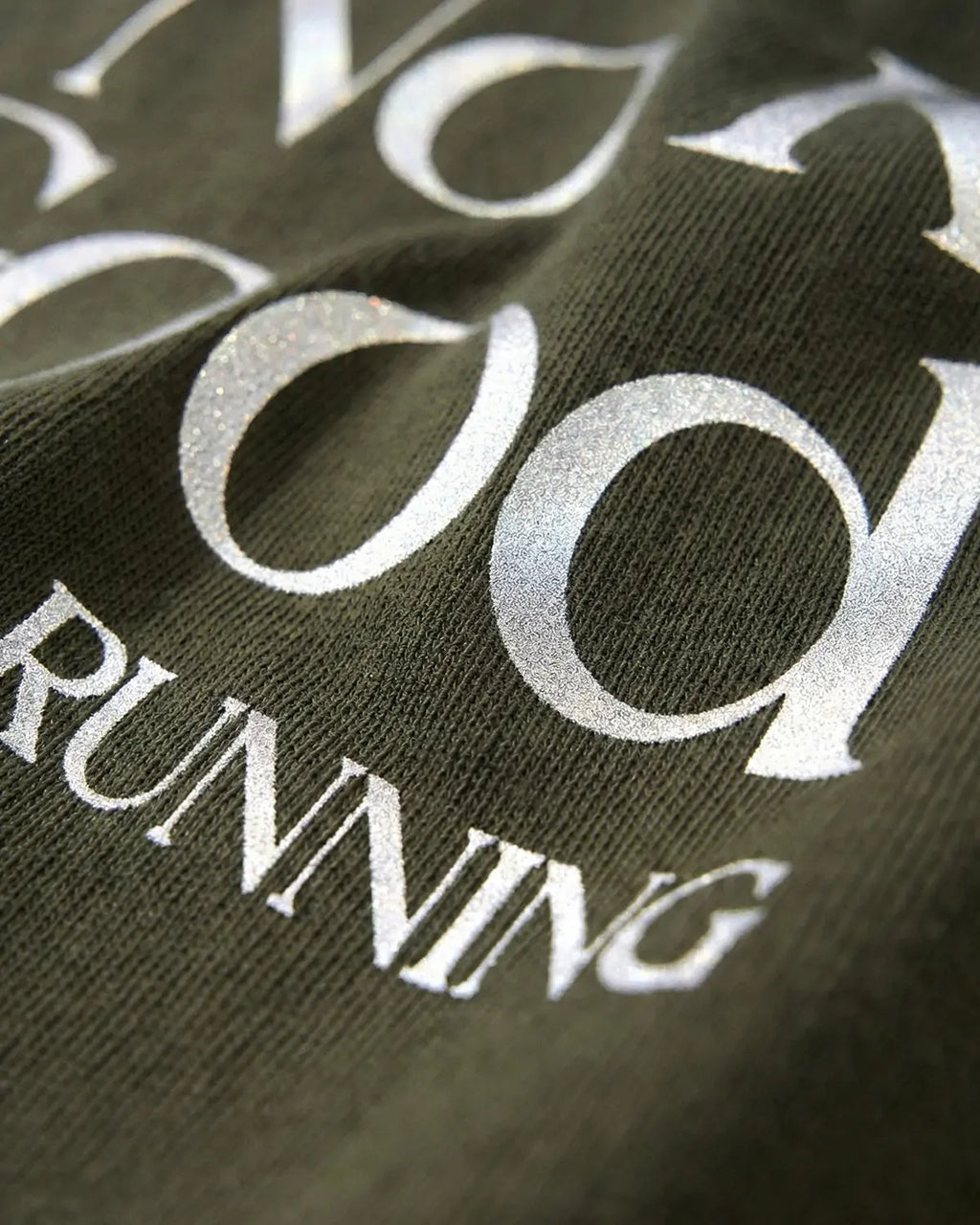 Distressed reflective washed T-shirt by INFLATION, featuring a casual fit with a faded, worn look and reflective details.