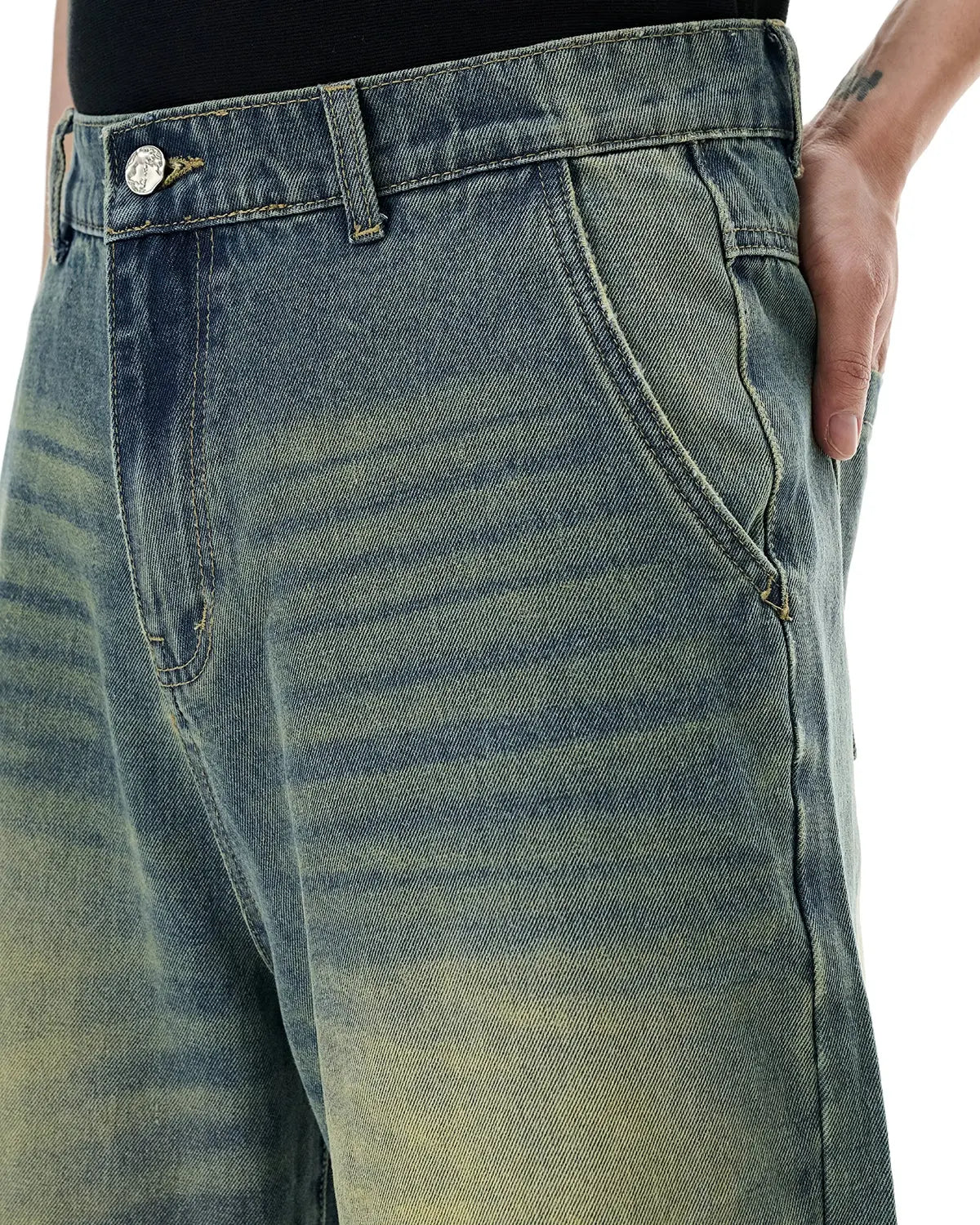 Retro washed denim jorts by INFLATION, featuring distressed details and frayed hems, styled as casual streetwear shorts.