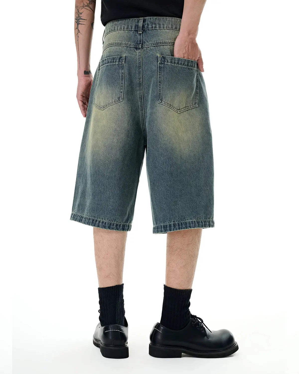 Retro washed denim jorts by INFLATION, featuring a classic distressed style and frayed hem for vintage streetwear look.