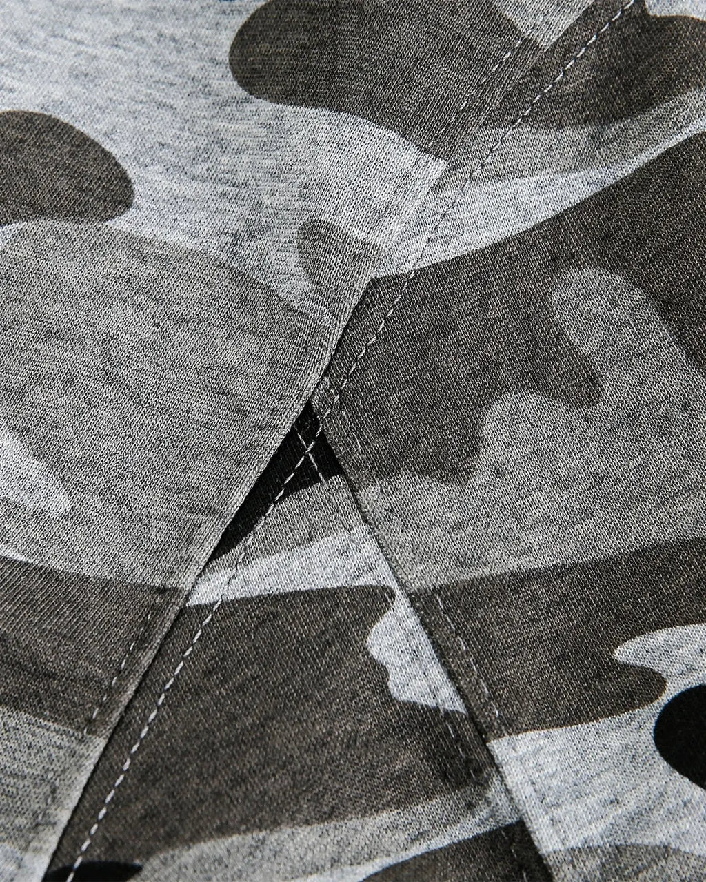 Inflation streetwear cropped camouflage zip-up hoodie with front pockets and adjustable hood, styled with a casual urban look.