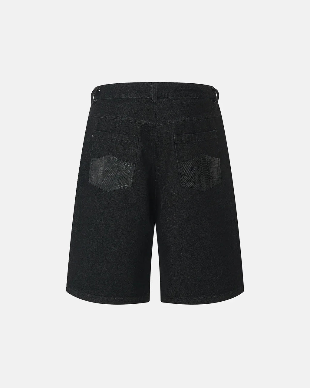 Black baggy long jorts by INFLATION featuring a loose fit, distressed denim, and casual streetwear style.
