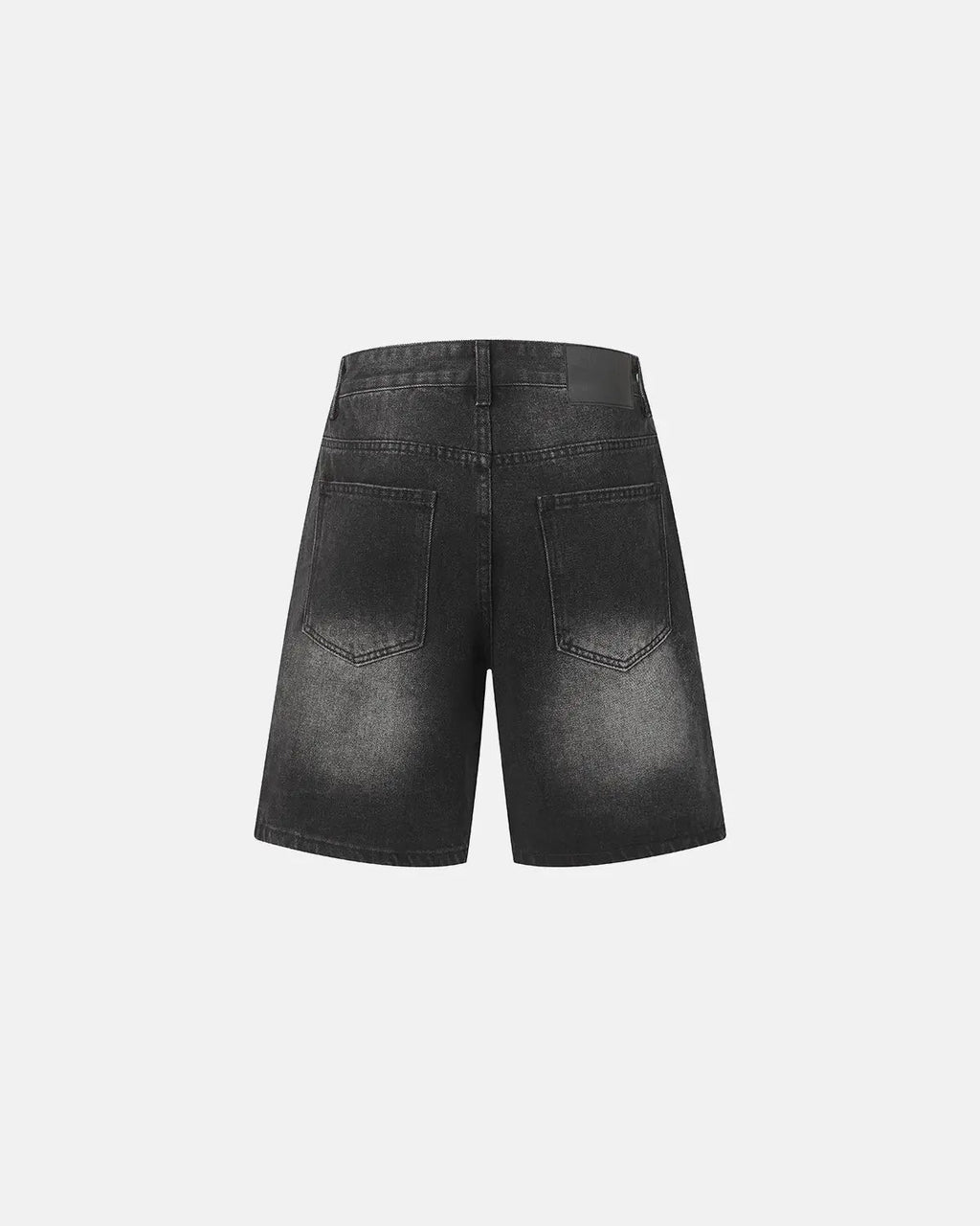 Ripped mid-length washed denim shorts by INFLATION, showing distressed details and casual fit on a model.