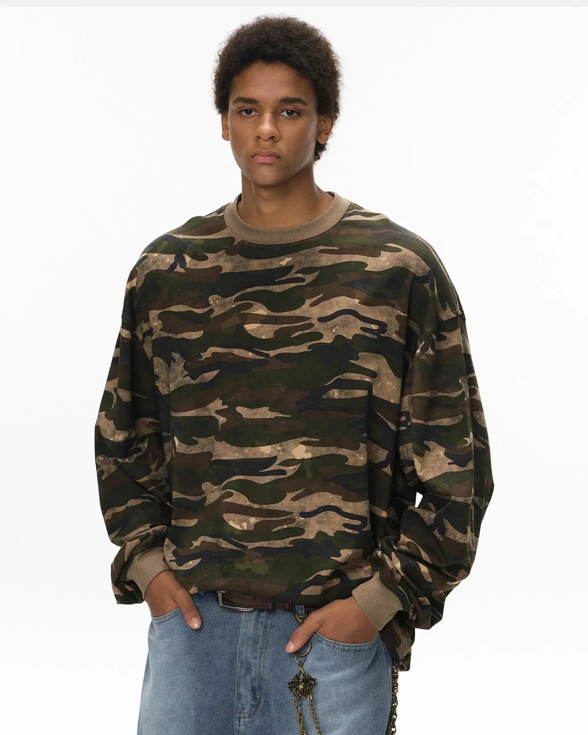 Boxy camo khaki tee from INFLATION streetwear, featuring a relaxed fit and military-inspired camouflage pattern.