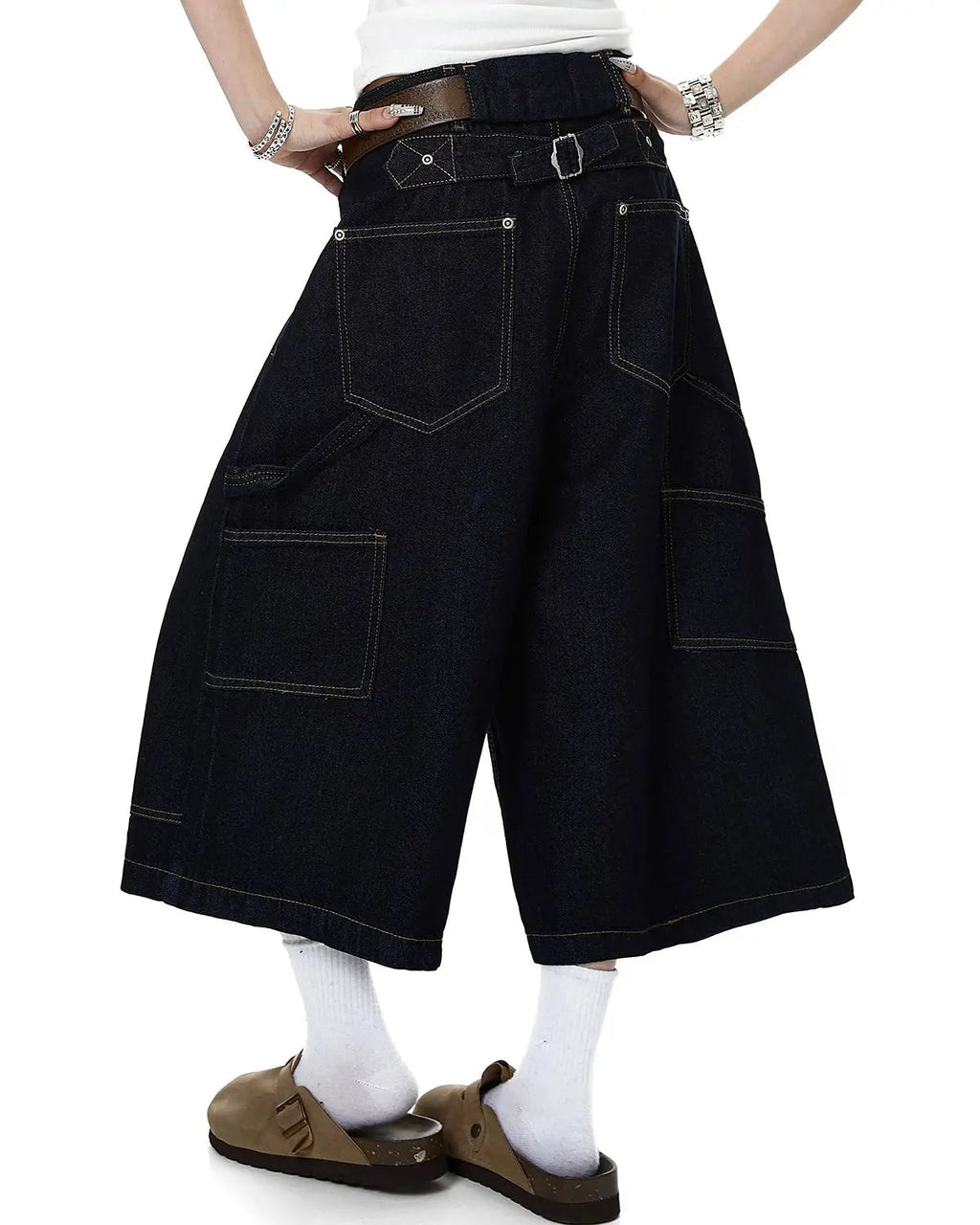 Deconstructed wide-leg longline jorts by INFLATION Streetwear, featuring distressed denim and oversized fit with frayed edges.
