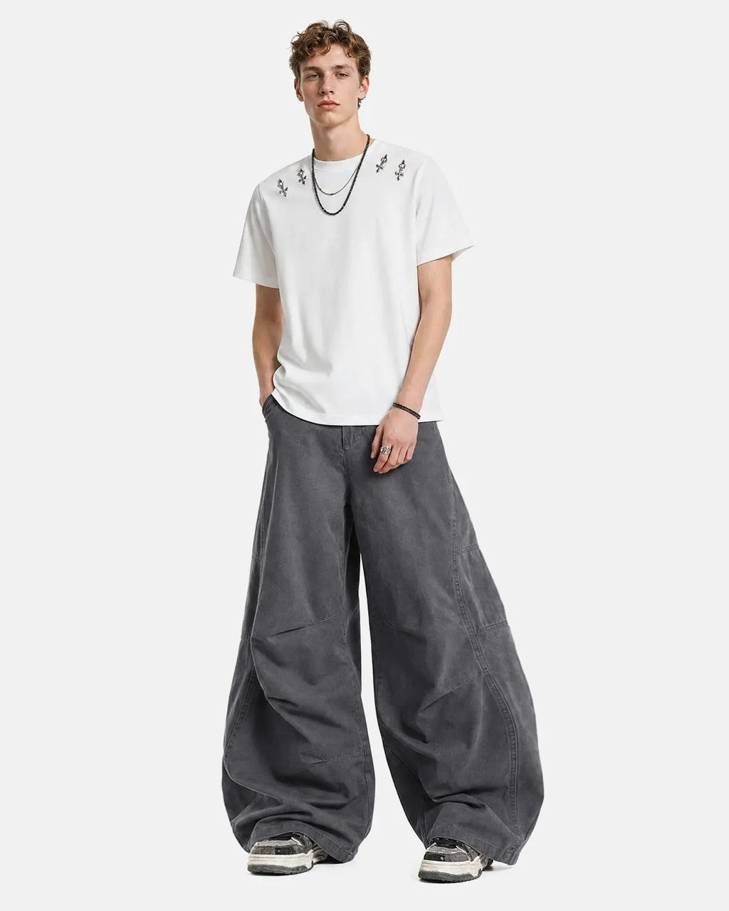Washed curved seam cargo pants by INFLATION featuring relaxed fit, multiple pockets, and casual streetwear style.